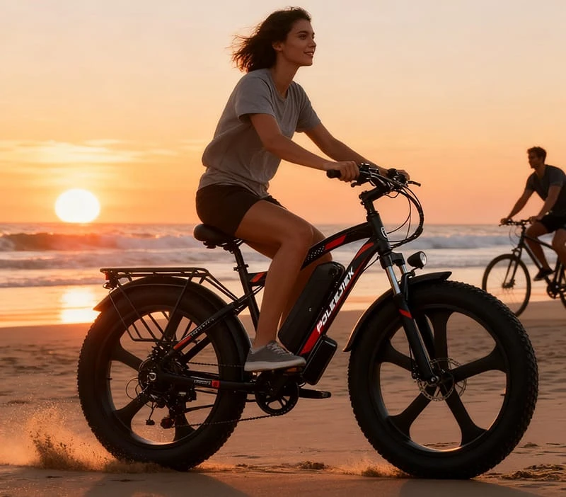 A person riding a POLEEJIEK fat tire electric bike confidently on a sandy beach at sunset.