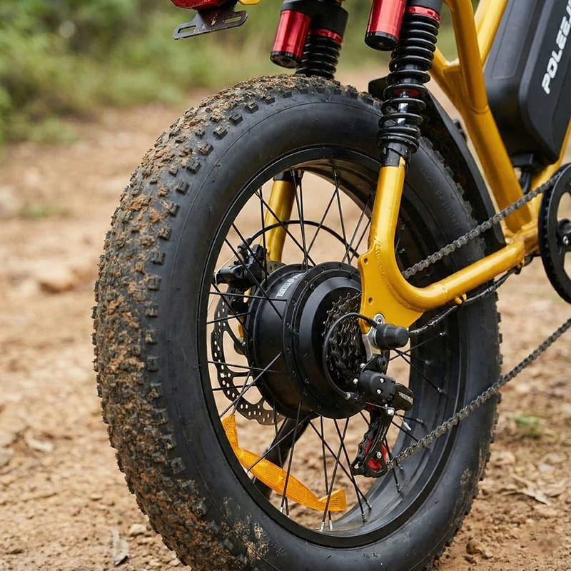 Close-up detail of the F6 20x4 inch fat tires and rear suspension, engineered for off-road durability and high-speed stability.